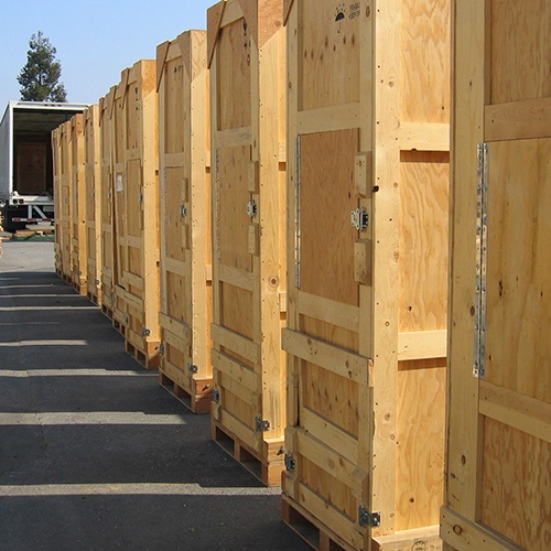 Wooden crates lined up in front of the truck