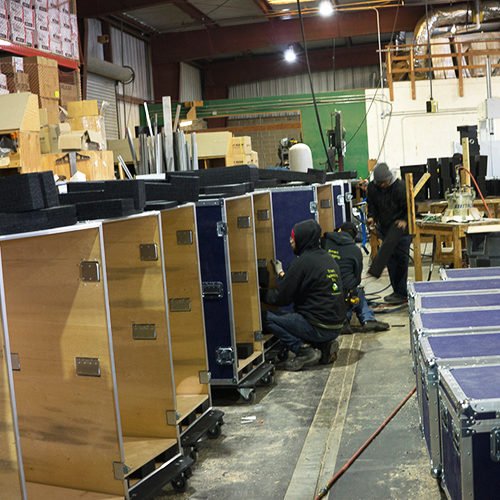 The LPC team at work building custom ATA cases with casters