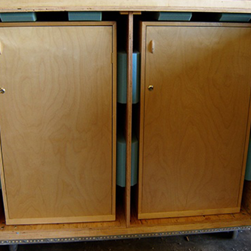 Cupboards in a Larson Packaging crate with foam lining for extra protection during transit