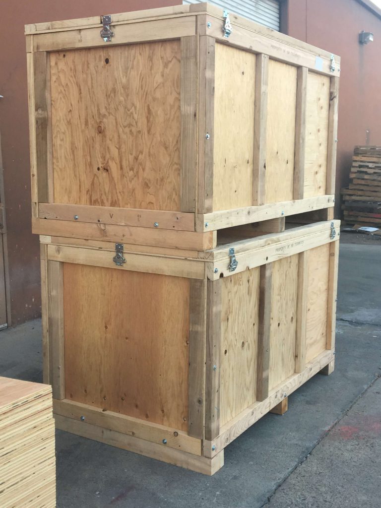 Two Mil-Spec standard wooden shipping crates stacked on top of each other